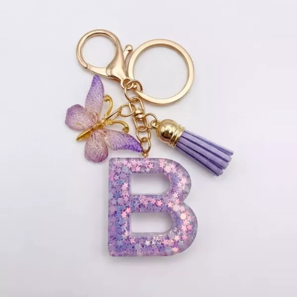 Porte-clés lettre B en résine paillettes violettes