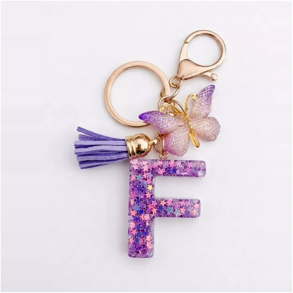 Porte-clés lettre F en résine paillettes violettes