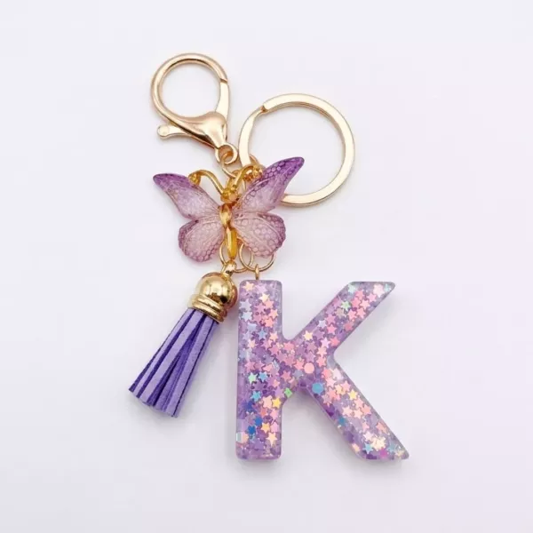 Porte-clés lettre K en résine paillettes violettes