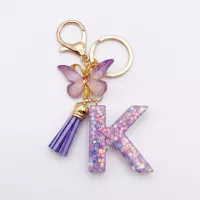 Porte-clés lettre K en résine paillettes violettes