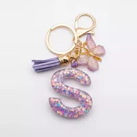 Porte-clés lettre S en résine paillettes violettes